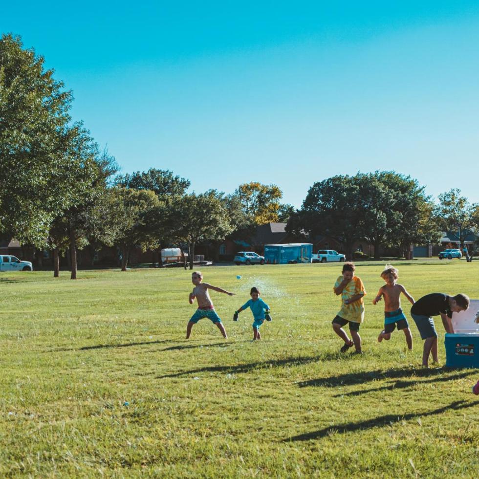 Photo by Anderson Schmig on Unsplash
Youth playing at a park in the sun