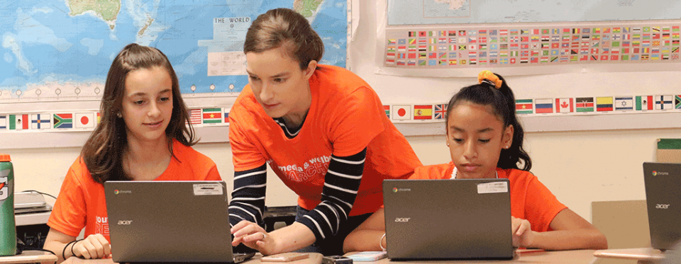 A mentor and two students participating in the workshop