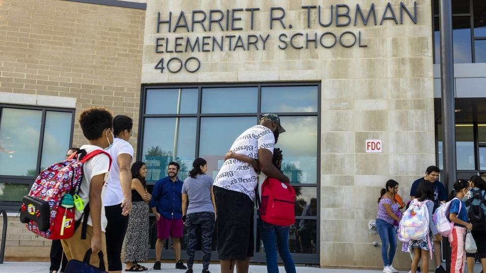 Carnegie Corporation of New York article photo of students and parents in front of Harriet R. Tubman Elementary School for the first day of school